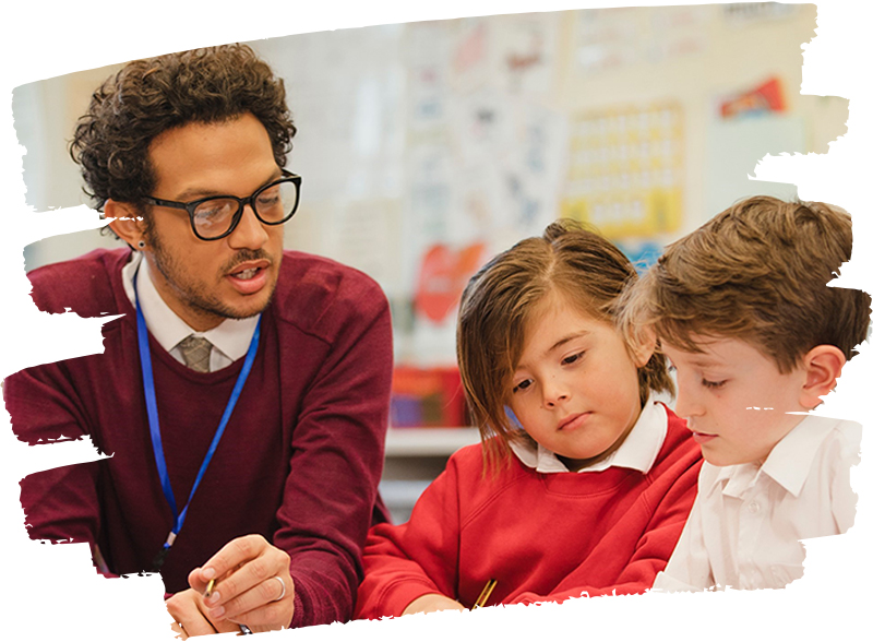 Volunteer talking to two young students